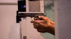 person holding black and silver semi automatic pistol
