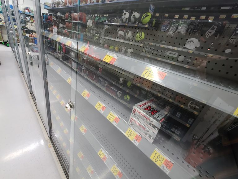 A nearly empty Walmart ammunition shelf from May 2021
