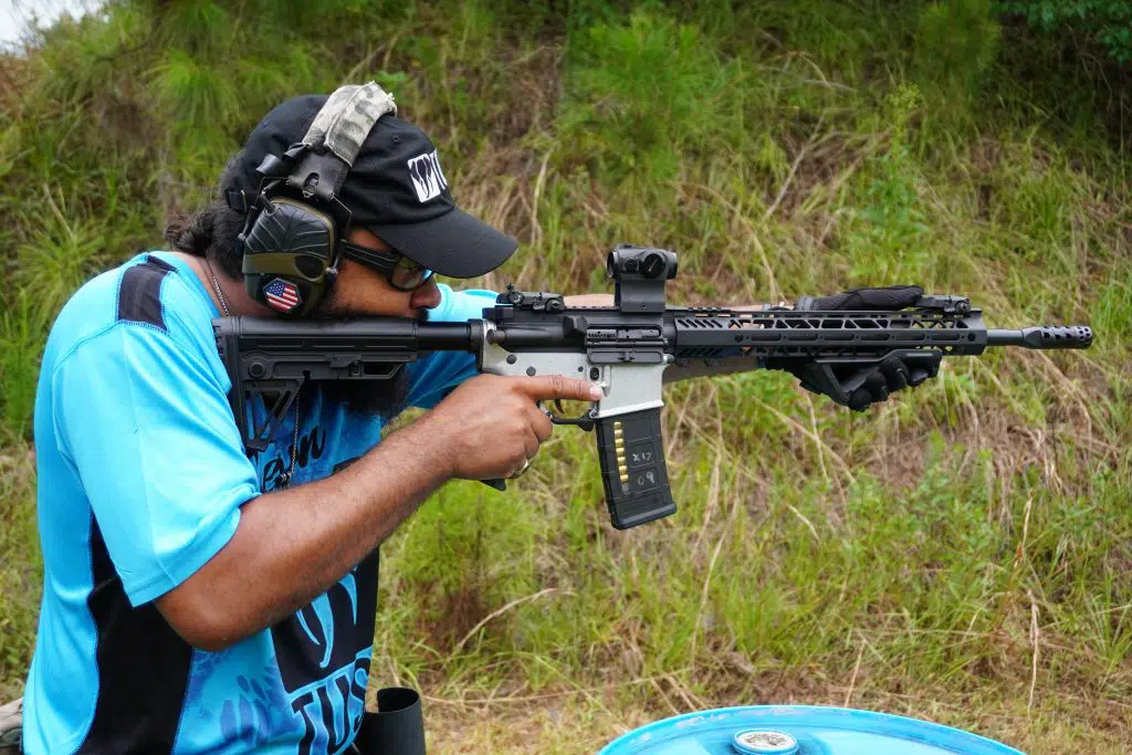 A competitor at the Gun Makers Match on June 19th, 2021 shoulders an AR-15