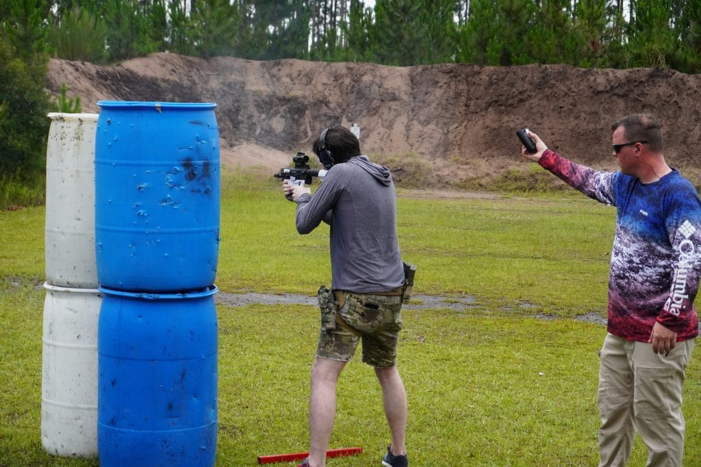 A competitor is timed as he shoots through a stage with a gun made largely from 3D-printed parts