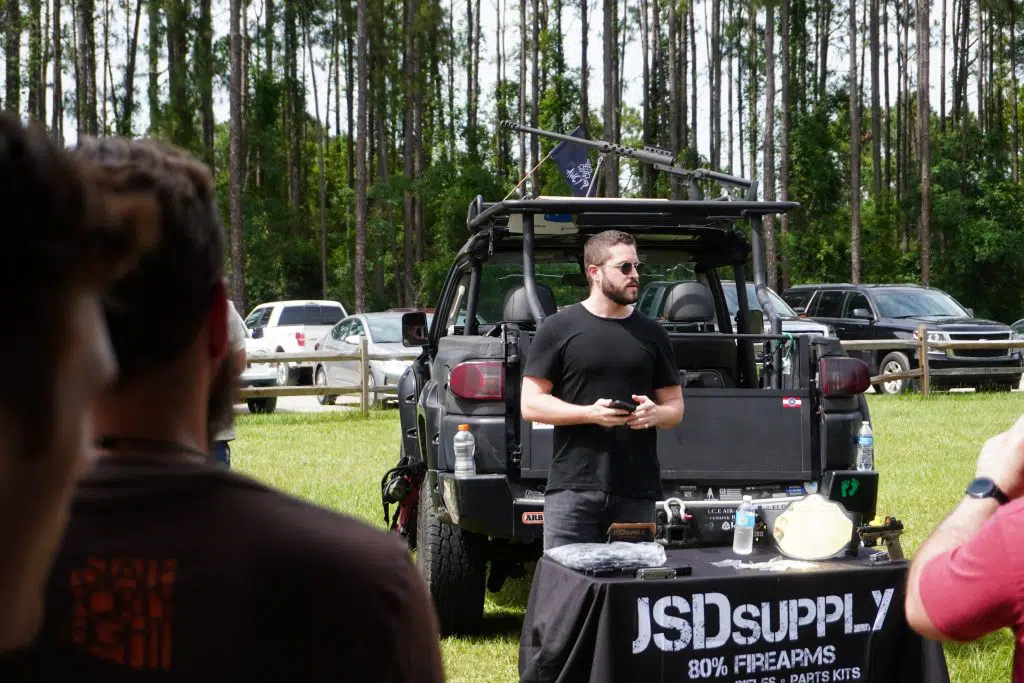 3D-printed gun pioneer Cody Wilson speaks to participants at the Gun Makers Match