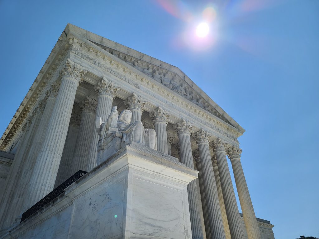 The sun hangs over the Supreme Court in Washington, D.C.