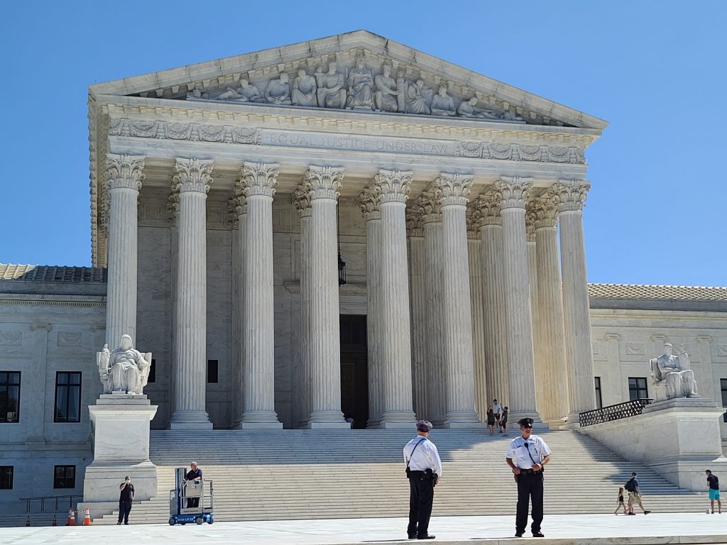 Police stand guard outside the Supreme Court
