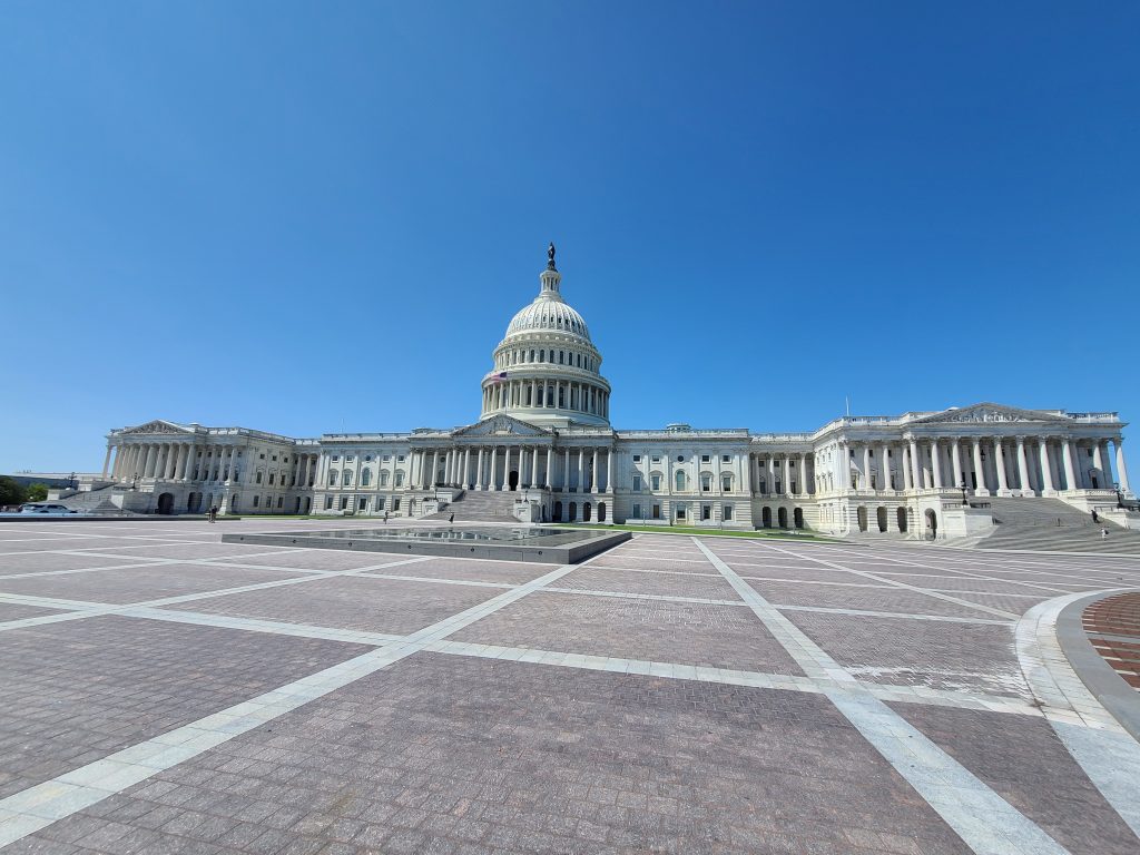 The Capitol Building sits under blue skies in Washington, D.C.