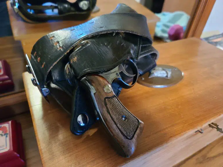 A .38 caliber service revolver in a leather holster