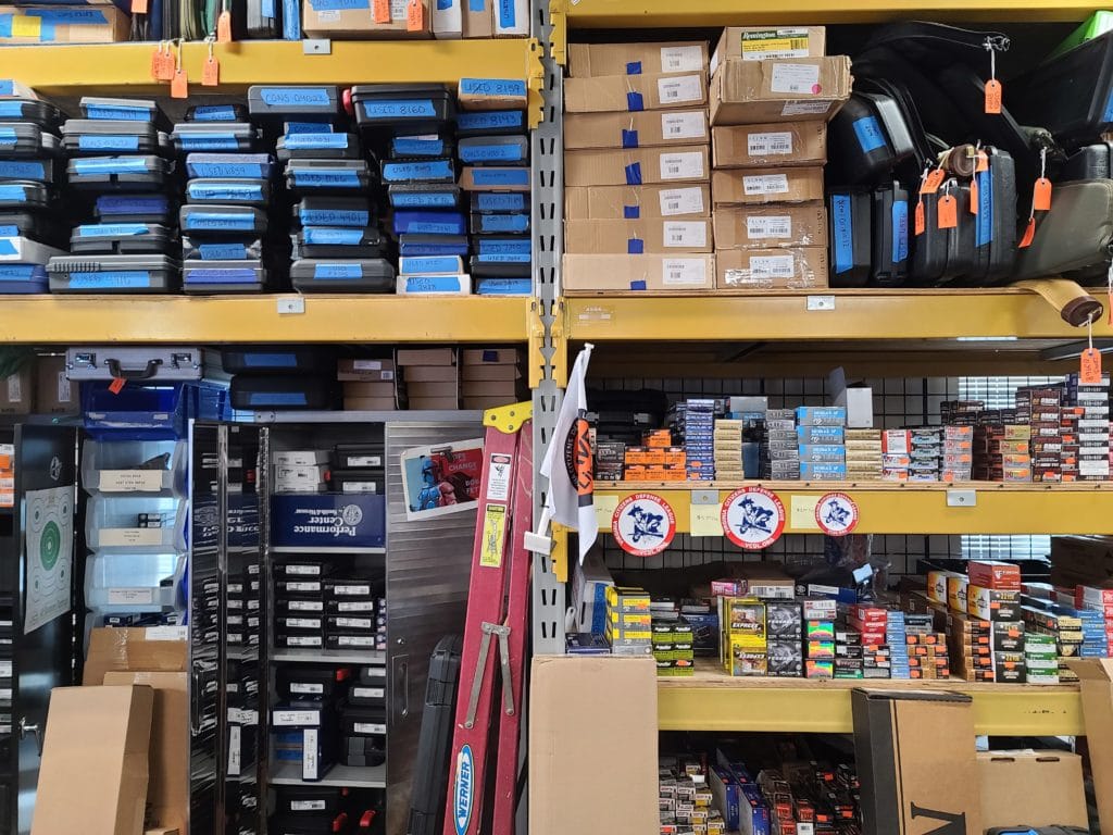 Gun and ammunition boxes at a gun store in January 2022