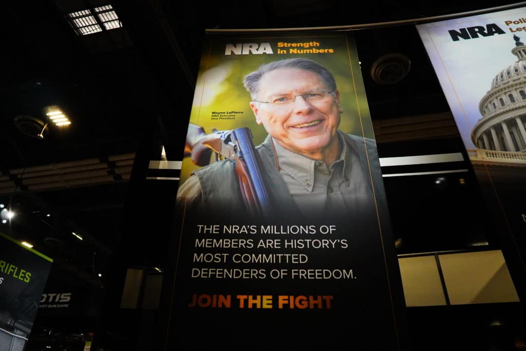 A massive poster of NRA Executive Vice President Wayne LaPierre at SHOT Show 2022