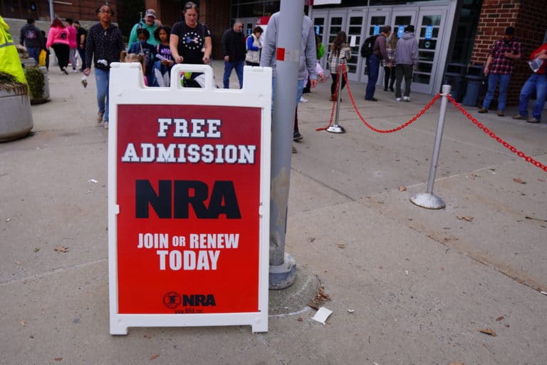 A sign offers free admission for NRA members at the Great American Outdoor Show