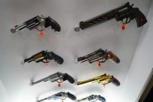A collection of revolvers on display at the 2022 NRA Great American Outdoor Show