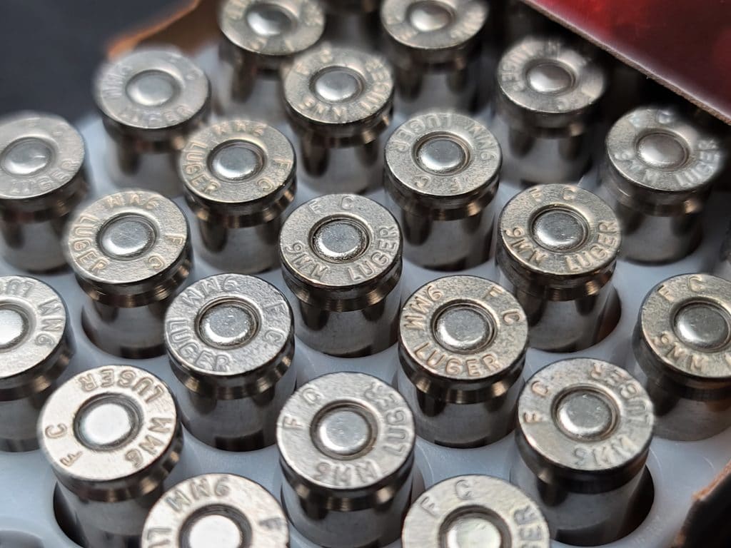 Rounds of 9mm ammunition stored in a box