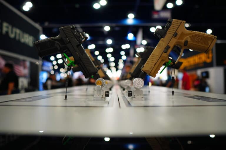 A series of pistols on display at the 2022 NRA Annual Meeting