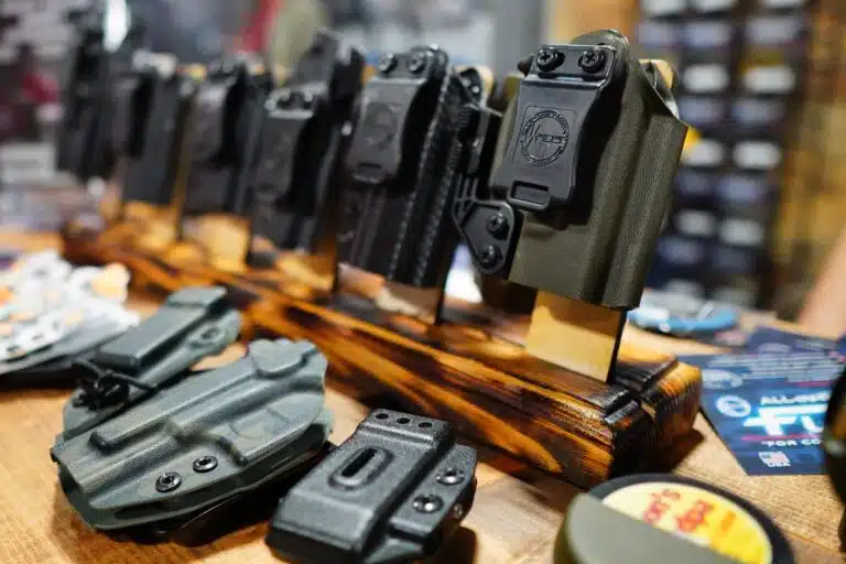 A collection of gun holsters on display at Shot Show 2023