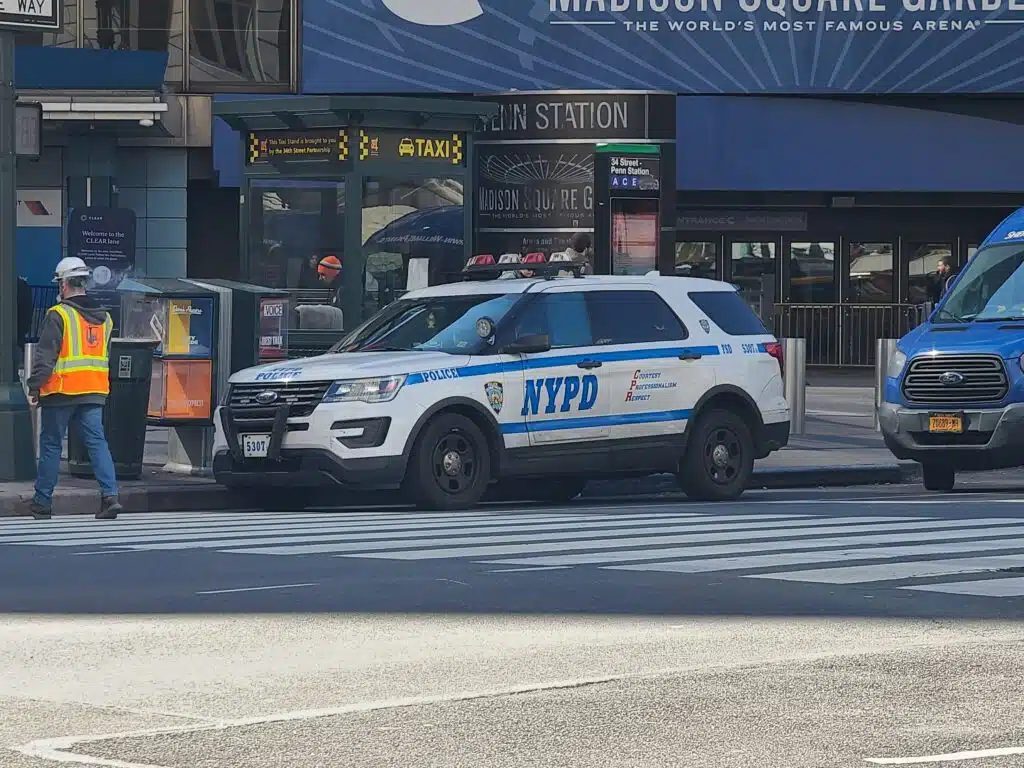 An NYPD officer sits outside Madison Square Garden