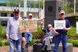 Gun-control advocates protest outside the 2023 NRA Annual Meeting