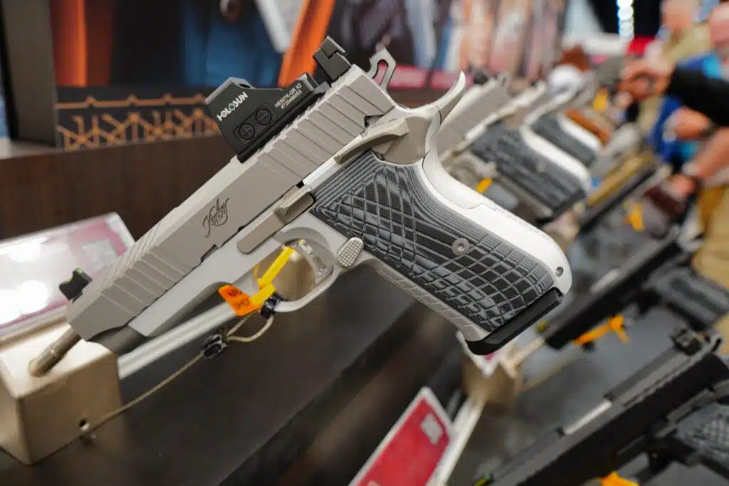 A row of handguns on display at the 2023 NRA Annual Meeting