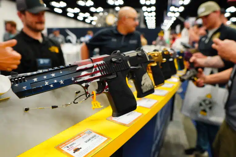 A Desert Eagle painted with an American flag on display at the 2023 NRA Annual Meeting