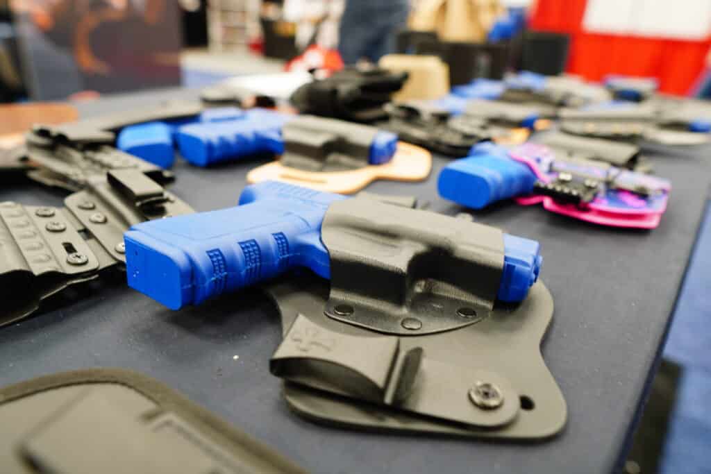 A selection of holsters on display at the 2023 NRA Annual Meeting