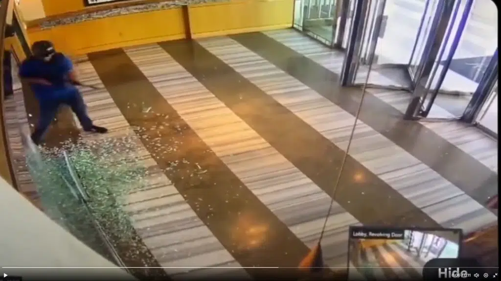 A gunman shoots out glass inside a Las Vegas building before being shot himself