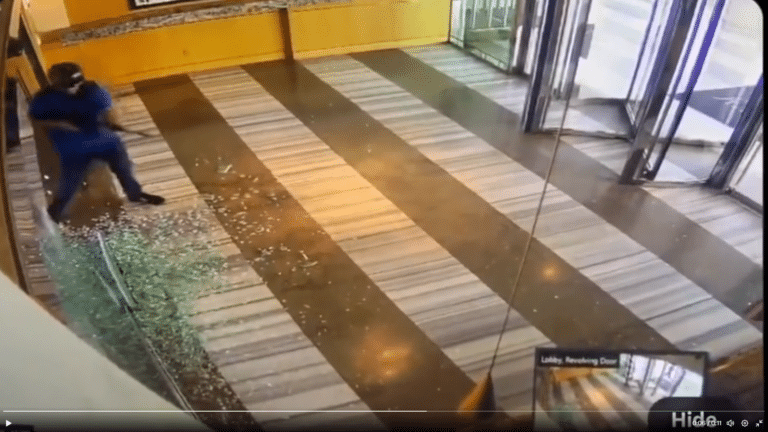 A gunman shoots out glass inside a Las Vegas building before being shot himself