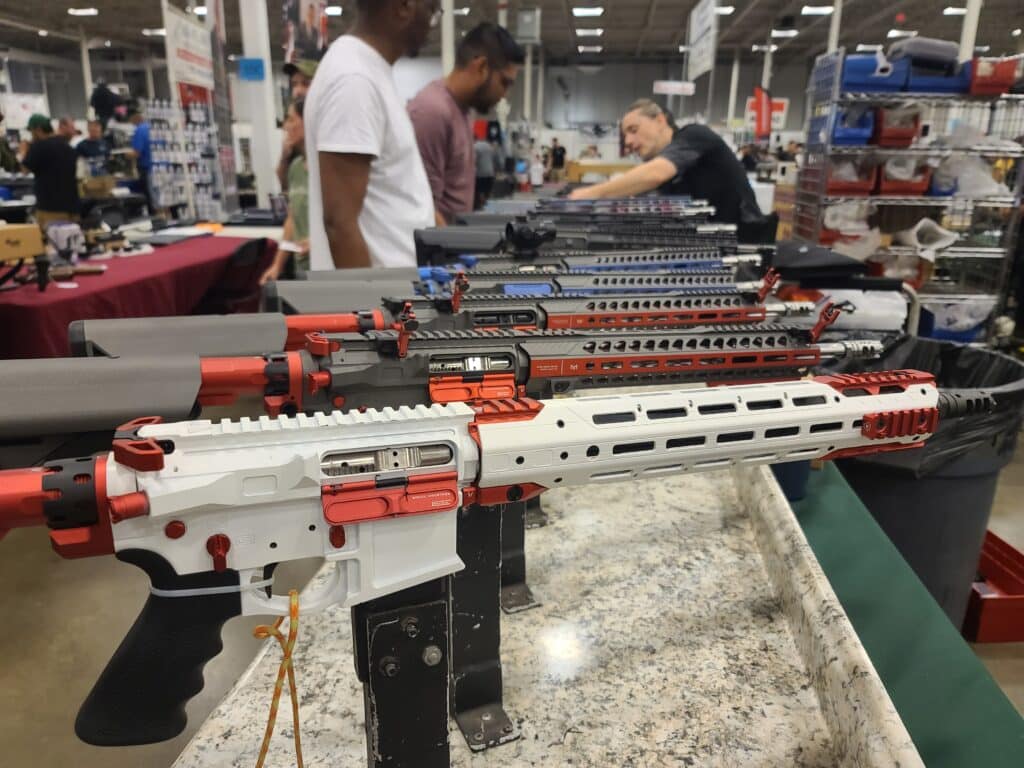 A collection of AR-15s on sale at a Virginia gun show in July 2023