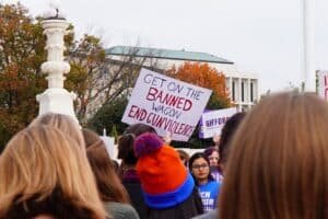 A gun-control activist holds a sign calling for a gun ban at a Washington, D.C. protest on November 7th, 2023