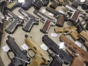 Handguns on display at a gun show during December 2023