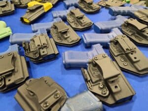 Pistol holsters on display at a 2023 gun show
