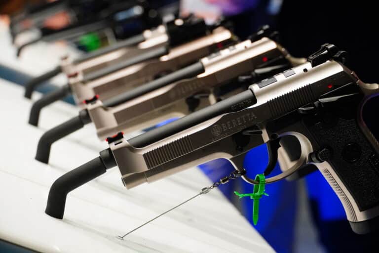 A selection of pistols at a SHOT Show 2024 booth