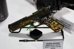 A gun emblazoned with the Gadsden Flag on display at the 2024 SHOT Show